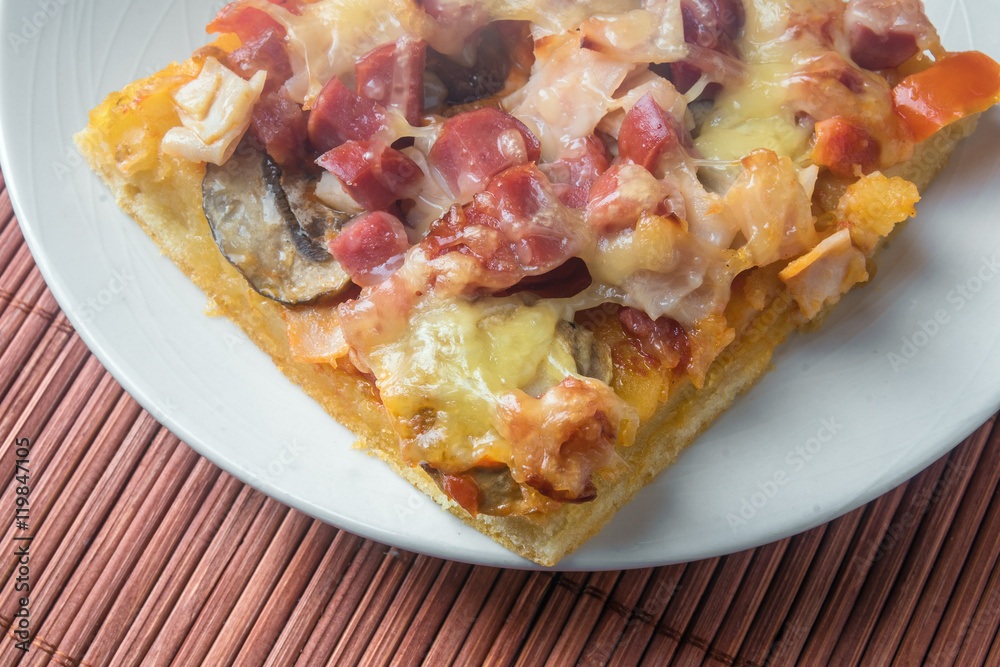 piece of pizza in a plate piece of pizza in a plate