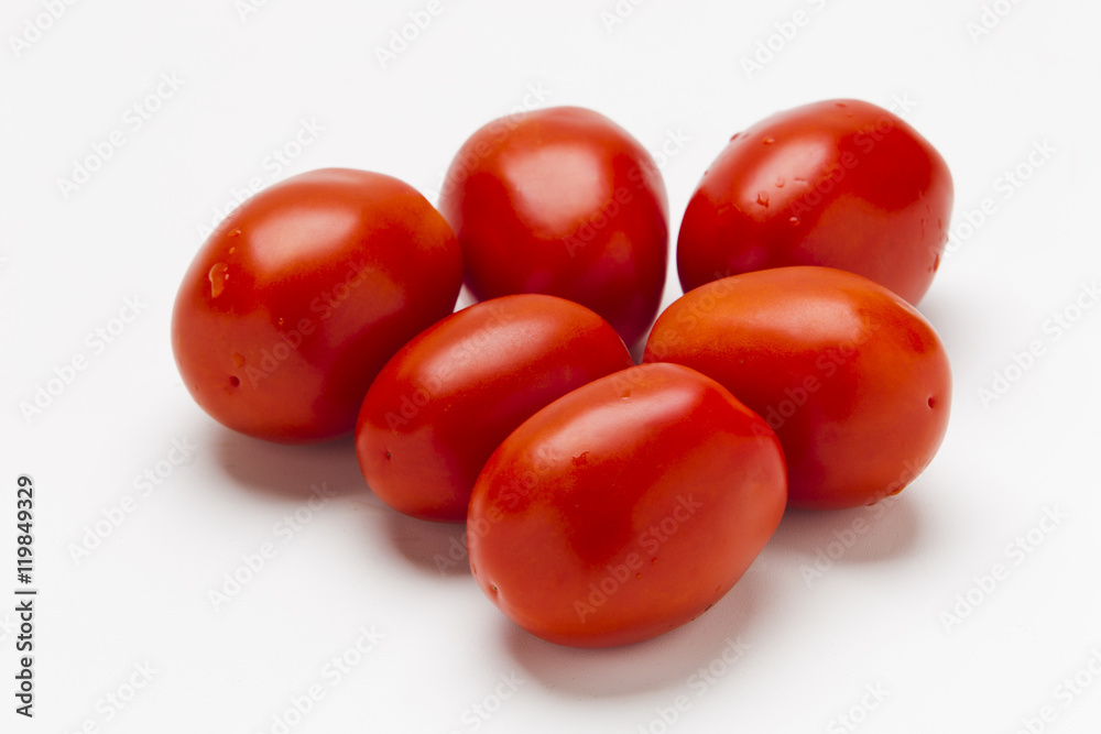 Red plum tomatoes on a white background Red plum tomatoes on a white background