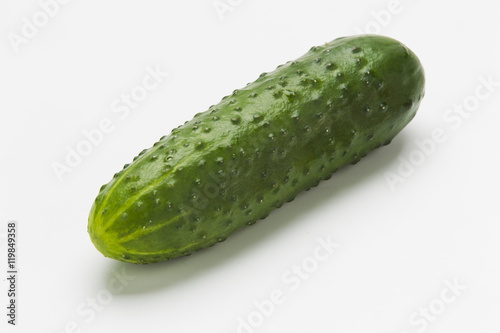 Green cucumbers on a white background