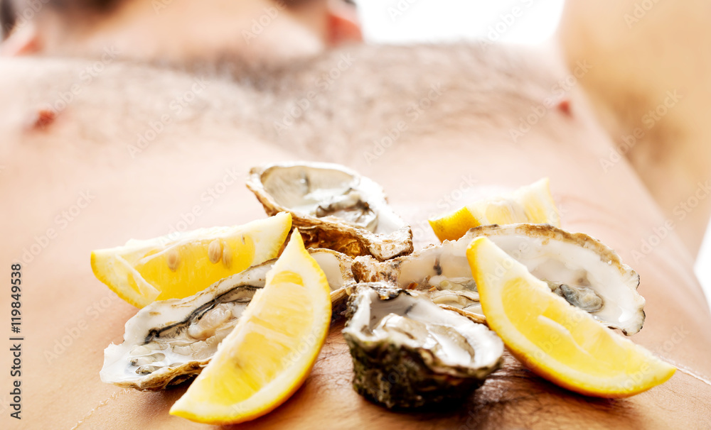 Oysters on man's belly.
