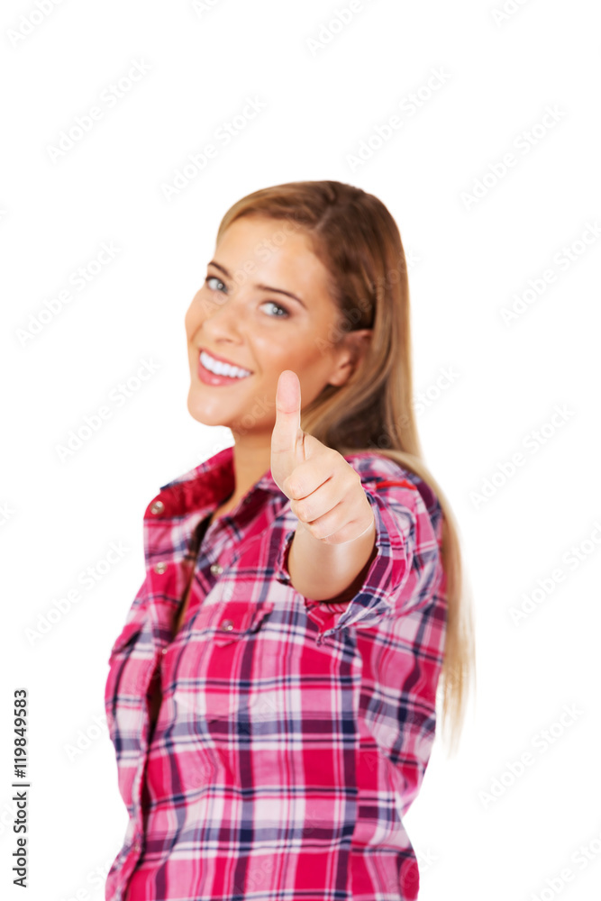 Young smiling woman with thumb up Young smiling woman with thumb up