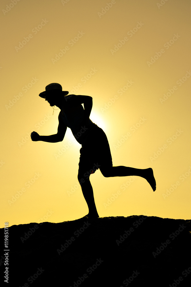 Back view silhouette of man standing backlight sunset summer evening, lens flare sky outdoors background Back view silhouette of man standing backlight sunset summer evening, lens flare sky outdoors background