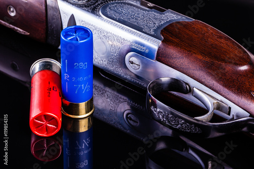 Photos Shotgun on black with shells