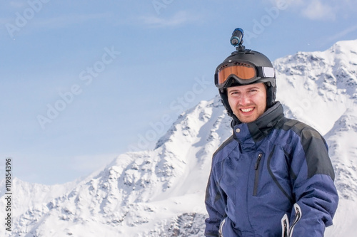 A Man On A Background Of Snowy Peaks