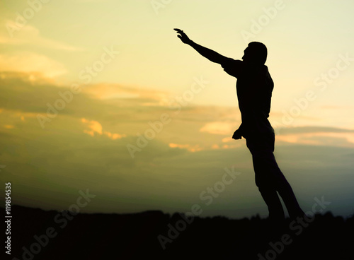Happy man jumping  blue sky on background