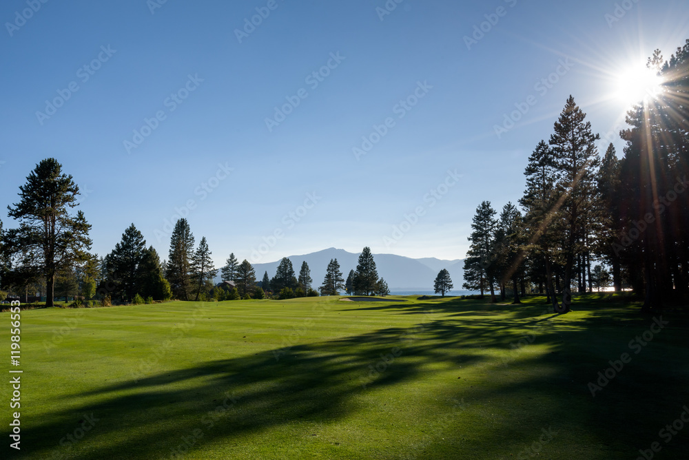 Late afternoon on a golf course, view from the fairway
