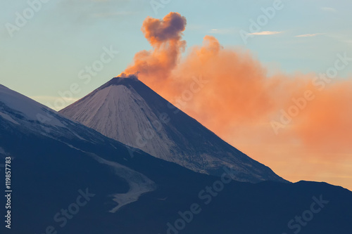 Emission ash from a volcano Klyuchevskoy dawn rays of sun.
