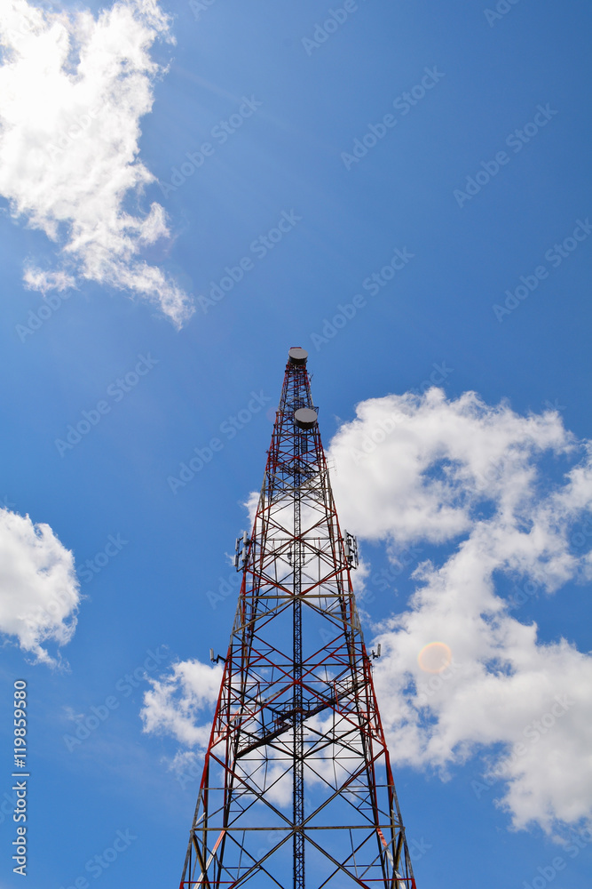 Communication antenna tower with blue sky background, Top of a cellular radio tower. Wireless technology for portable transceivers such as mobile, cell, smart phones, pagers, tablets. Mobile network. Communication antenna tower with blue sky background, Top of a cellular radio tower. Wireless technology for portable transceivers such as mobile, cell, smart phones, pagers, tablets. Mobile network.