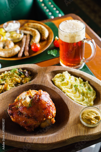 eisbein with braised cabbage, salad and beer