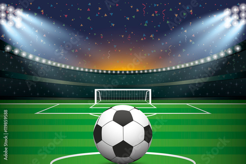 Soccer ball with soccer stadium and confetti background. © n.ko.studios