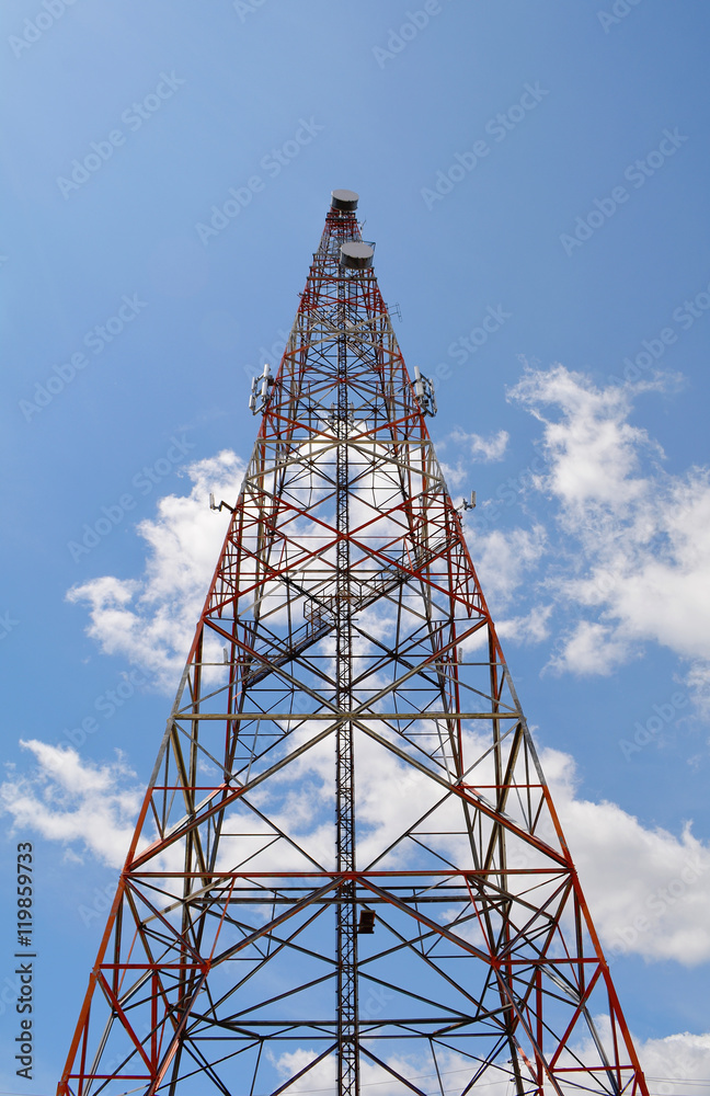 Communication antenna tower with blue sky background, Top of a cellular radio tower. Wireless technology for portable transceivers such as mobile, cell, smart phones, pagers, tablets. Mobile network. Communication antenna tower with blue sky background, Top of a cellular radio tower. Wireless technology for portable transceivers such as mobile, cell, smart phones, pagers, tablets. Mobile network.