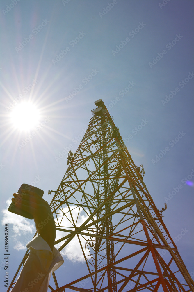 Woman hand with smart phone looking for wi fi connection concept. Outside home. communication antenna tower behind. Online social activity and connection with friends and people concept. Woman hand with smart phone looking for wi fi connection concept. Outside home. communication antenna tower behind. Online social activity and connection with friends and people concept.