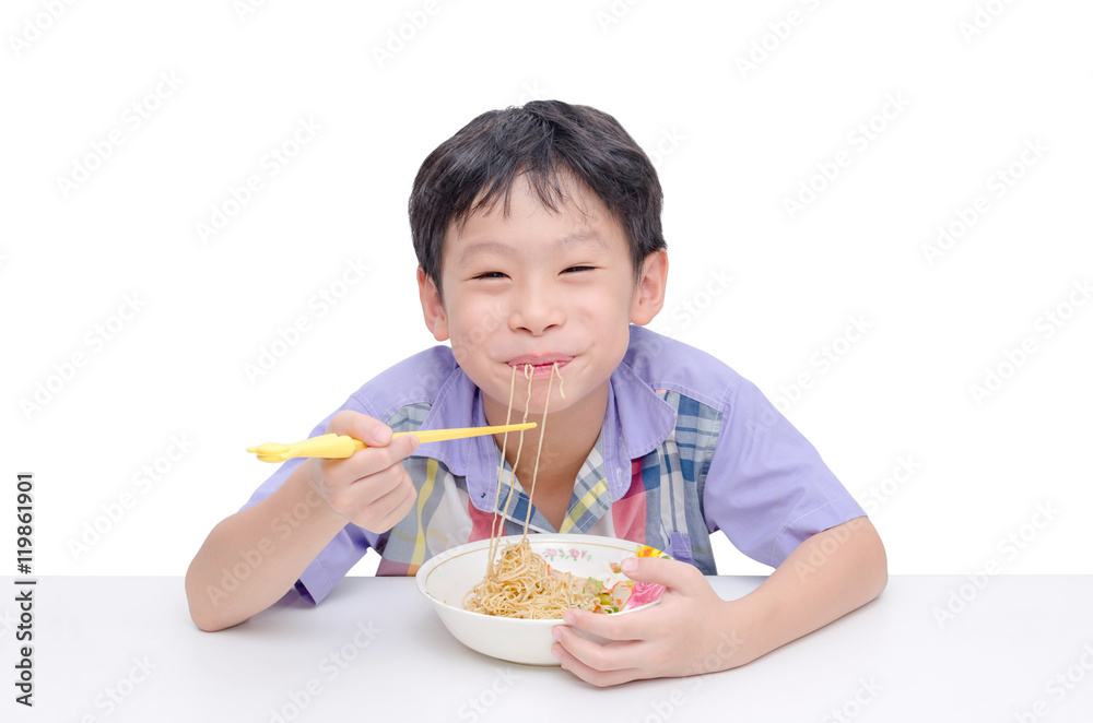 Young asian boy eating noodle by chob stick Young asian boy eating noodle by chob stick