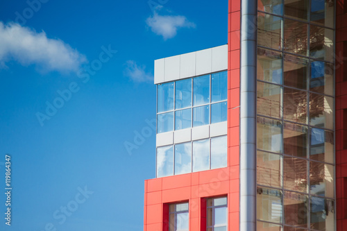 modern building on a background of blue sky with clouds