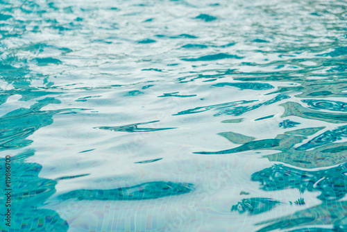 Blue swimming pool rippled water . photo