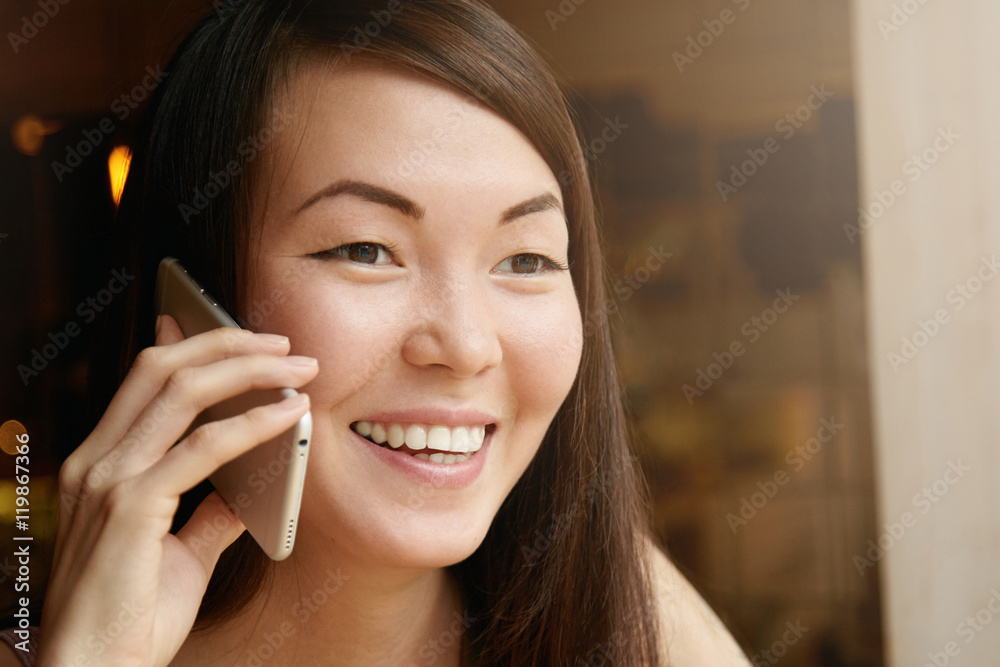 Highly-detailed portrait of cute student girl with long dark hair and healthy clear skin having phone conversation with her parents, sharing her success after passing successfully exams at college Highly-detailed portrait of cute student girl with long dark hair and healthy clear skin having phone conversation with her parents, sharing her success after passing successfully exams at college