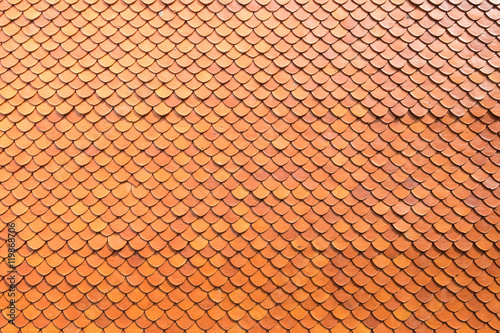 surface of bright red or orange tile roof in the temple or measure, abstract background texture
