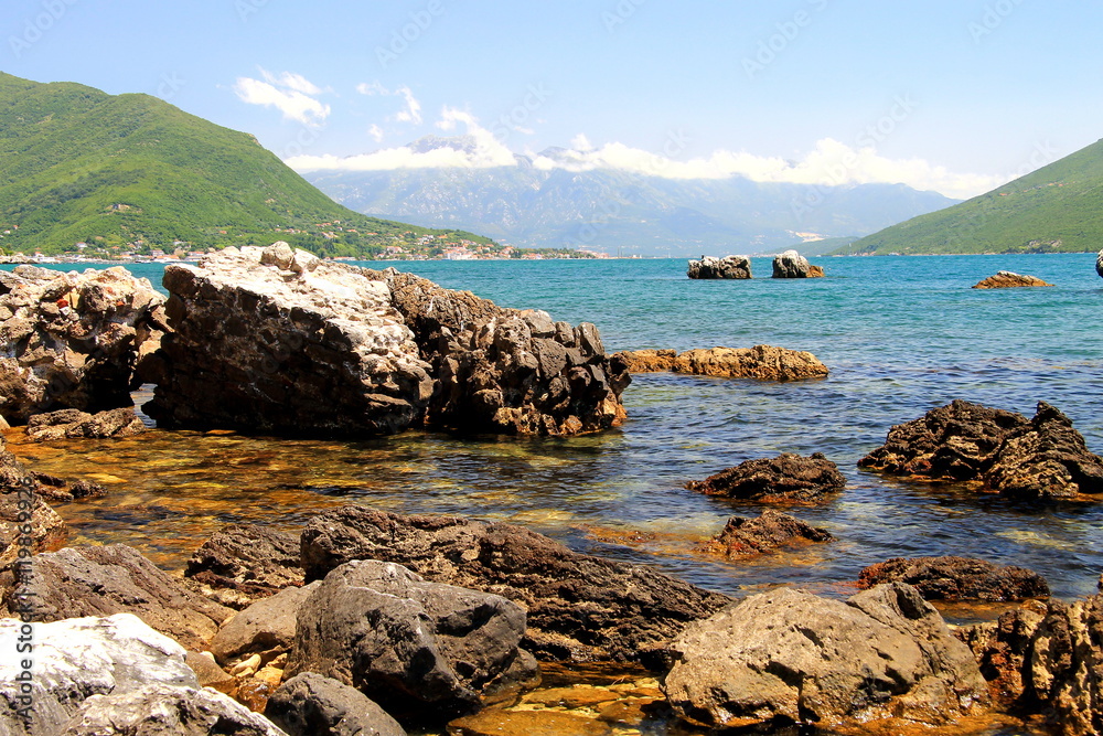 Beach with beautiful picturesque rocks in the sea and mountains in the distance Herceg Novi,  Montenegro, Bay of  Kotor.