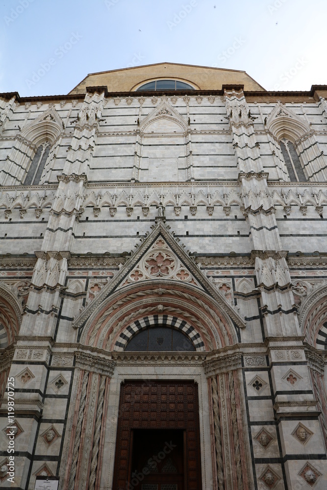 Building facade of Battistero di San Giovanni in Siena, Tuscany Italy