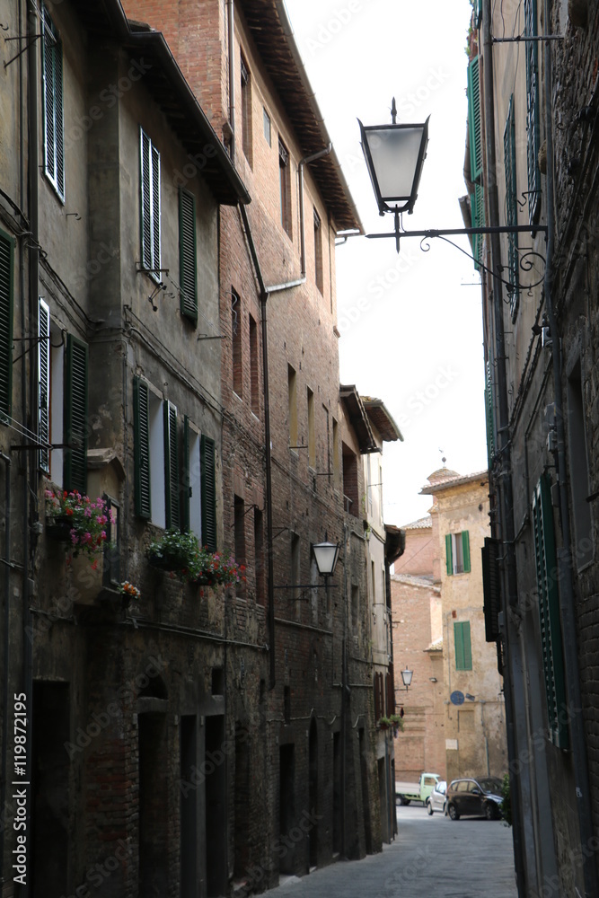 Typical narrow alley in Siena, Tuscany Italy 