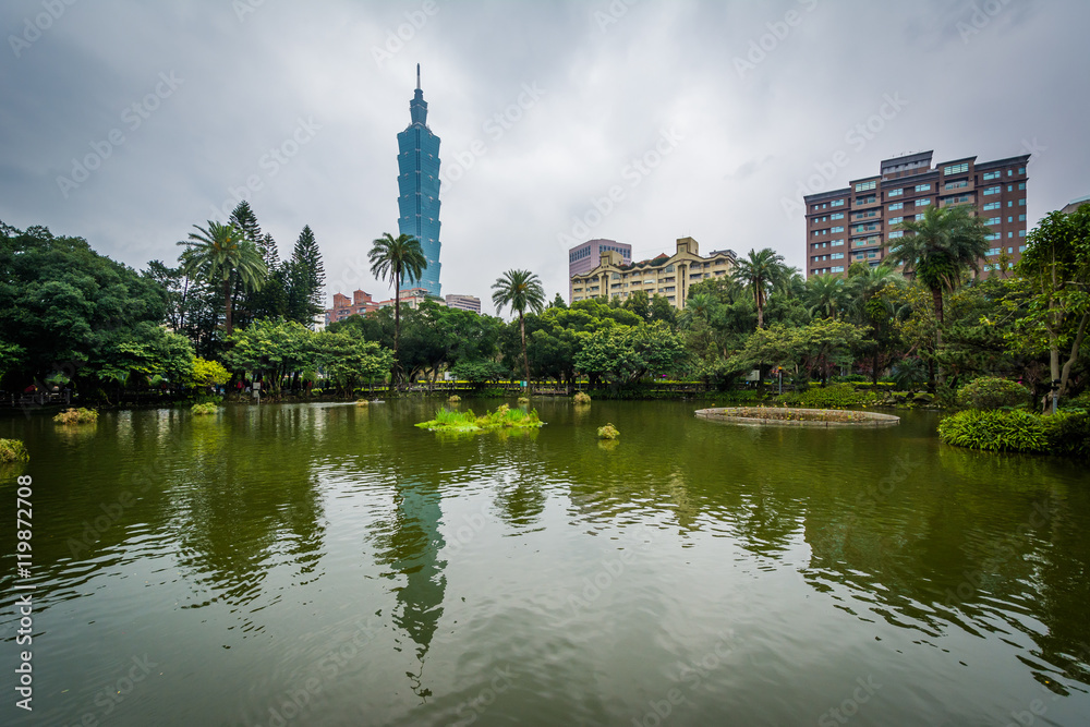 Taipei 101 and pond at Zhongshan Park, in Taipei, Taiwan.