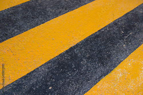 old yellow and black painted cement floor background © oatautta