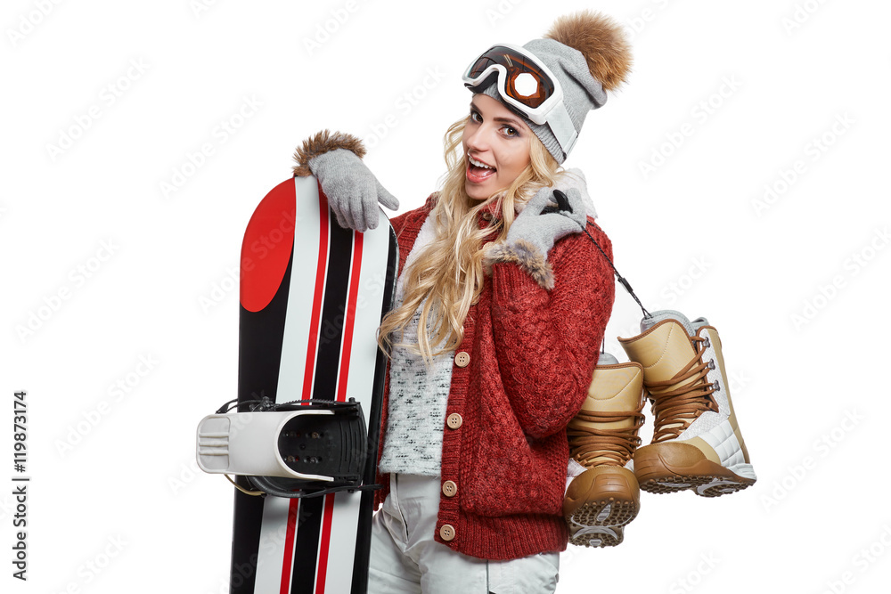 attractive young woman standing holding snowboard