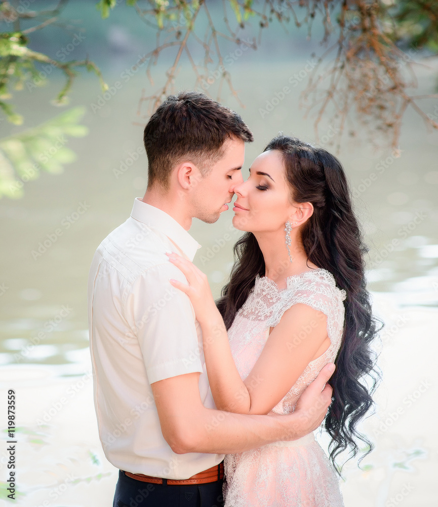 Romantic beautiful couple kissing outside Romantic beautiful couple kissing outside