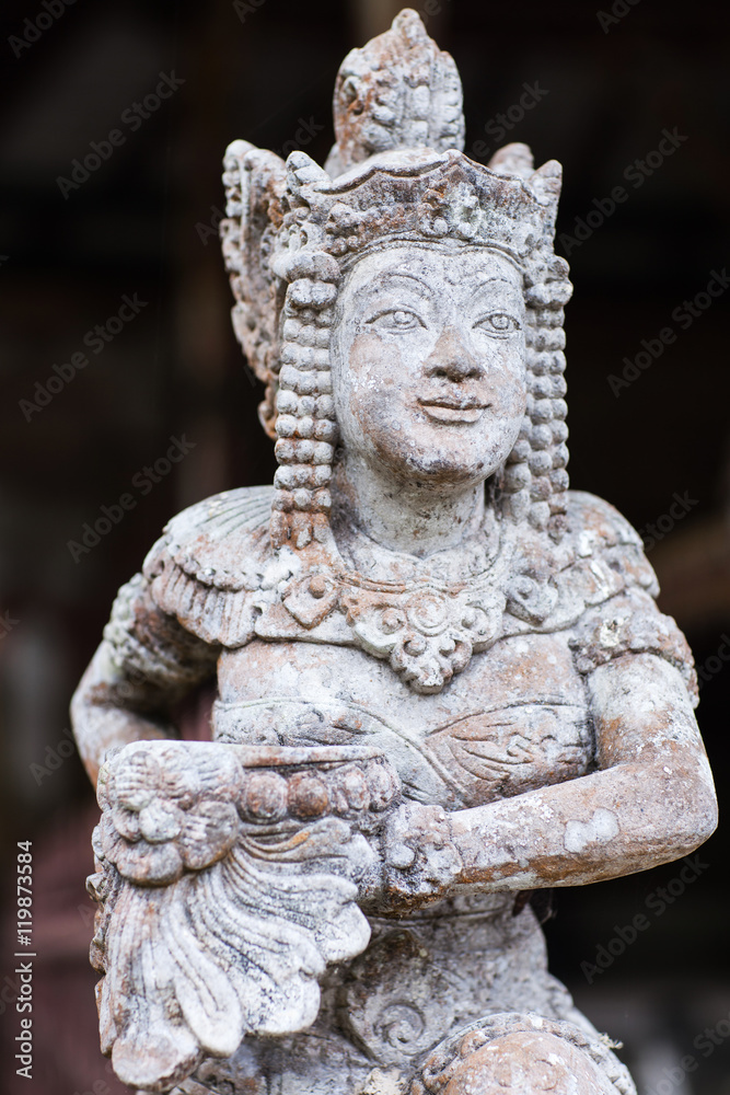 Stone statuette of the deity in a Balinese temple