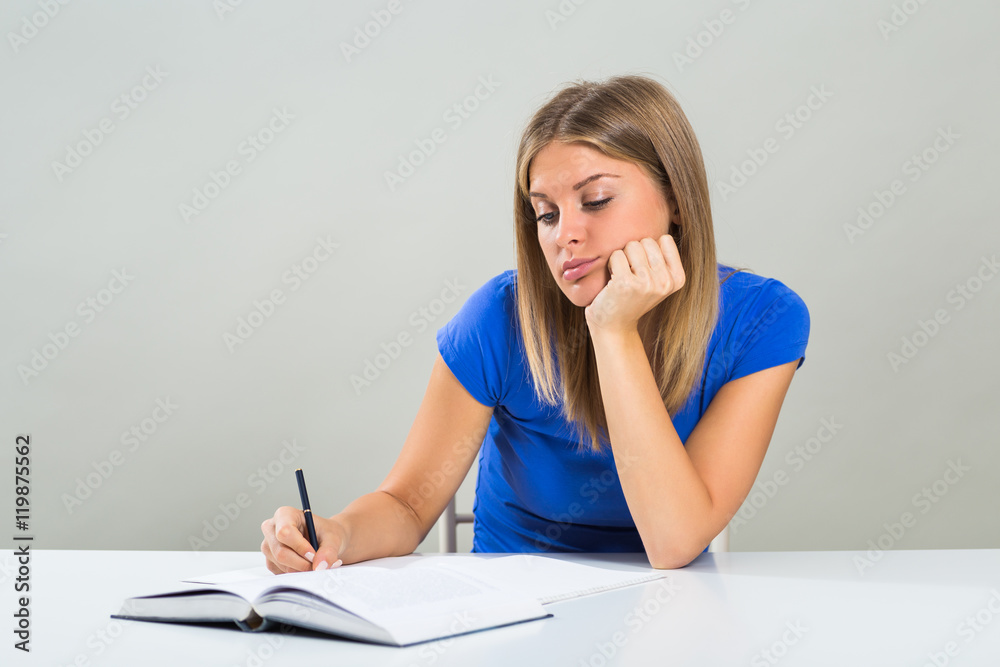 Sad female student doesn't want to study. Sad female student doesn't want to study.
