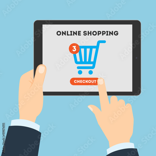 Online shopping concept. Buying products and service through Internet using tablet. Shopping cart with checkout button.