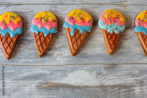 Ice cream shaped biscuits. Glazed cookies on gray background. Fresh and tasty confectionery. Making the kids happy.
