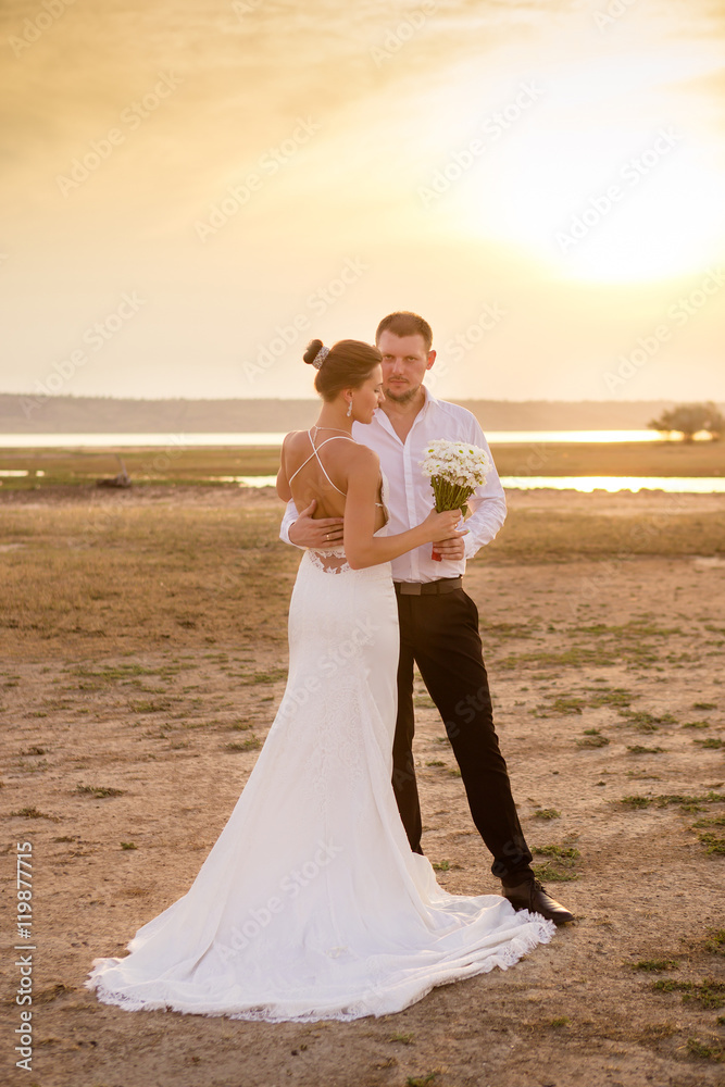 Couple in the sunset light wedding photo Couple in the sunset light wedding photo