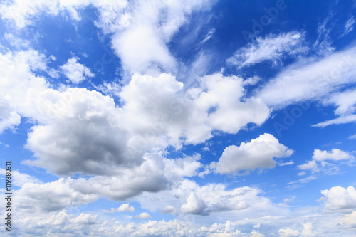Blue sky with white clouds and rain clouds. The vast blue sky and clouds sky on sunny day. White fluffy clouds in the blue sky.
