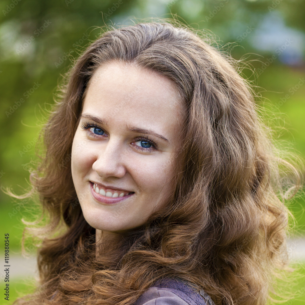 Portrait of beautiful young happy woman