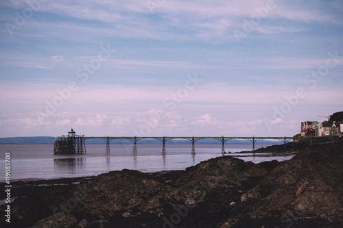 View over rocks at Clevedon sea front, including pier in backgro © Christopher Hall