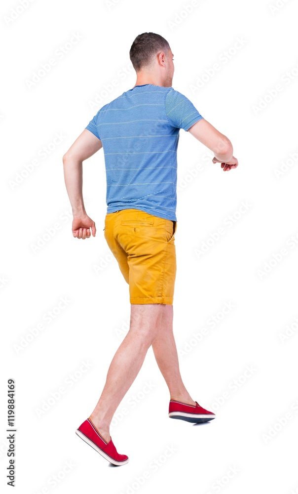Back view of running man in t-shirt and shorts. Walking guy in motion. Rear view people collection. Backside view of person. Isolated over white background. Back view of running man in t-shirt and shorts. Walking guy in motion. Rear view people collection. Backside view of person. Isolated over white background.