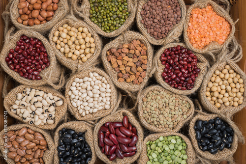 Various colorful dried legumes in sackcloth for background