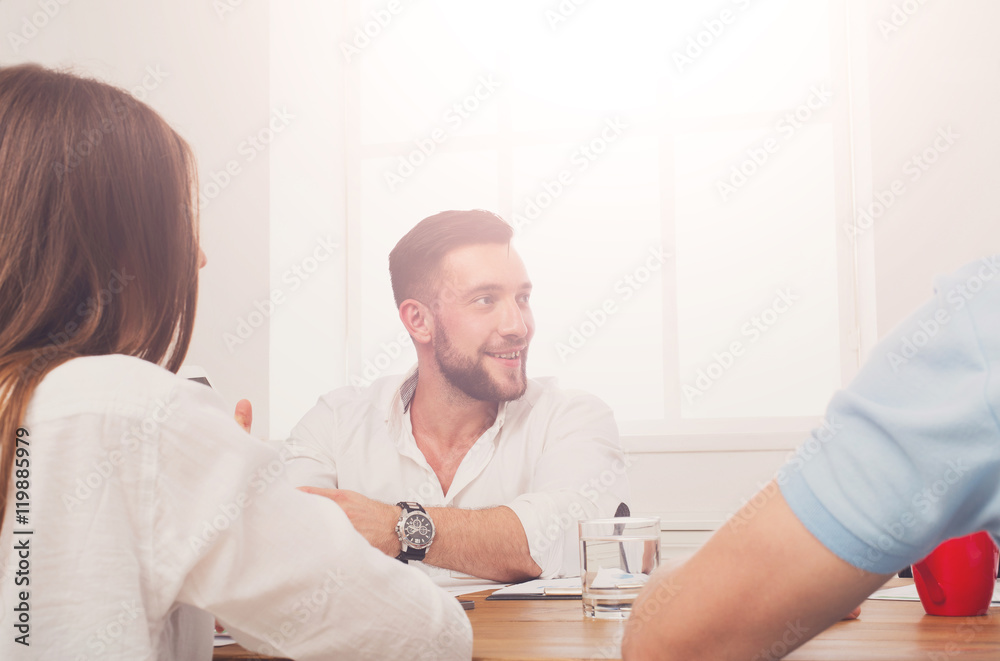 Fototapeta premium Business meeting. Young hipster businessman in modern office
