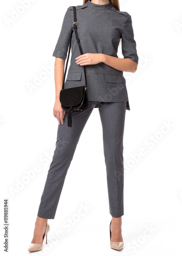 Woman holding a handbag isolated on white background