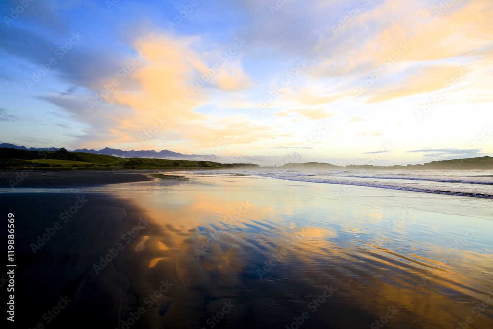 Sandy beach at Sunset in Westport of New Zealand.