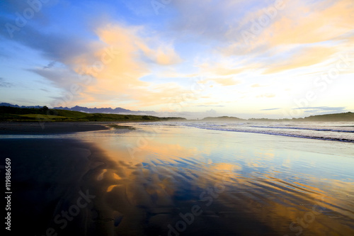 Sandy beach at Sunset in Westport of New Zealand. © Iriana Shiyan