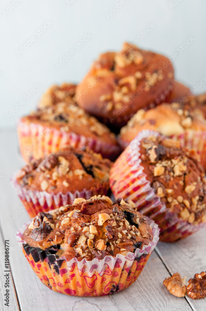 Homemade Nut Muffins cupcake on a wooden table, soft focus Homemade Nut Muffins cupcake on a wooden table, soft focus