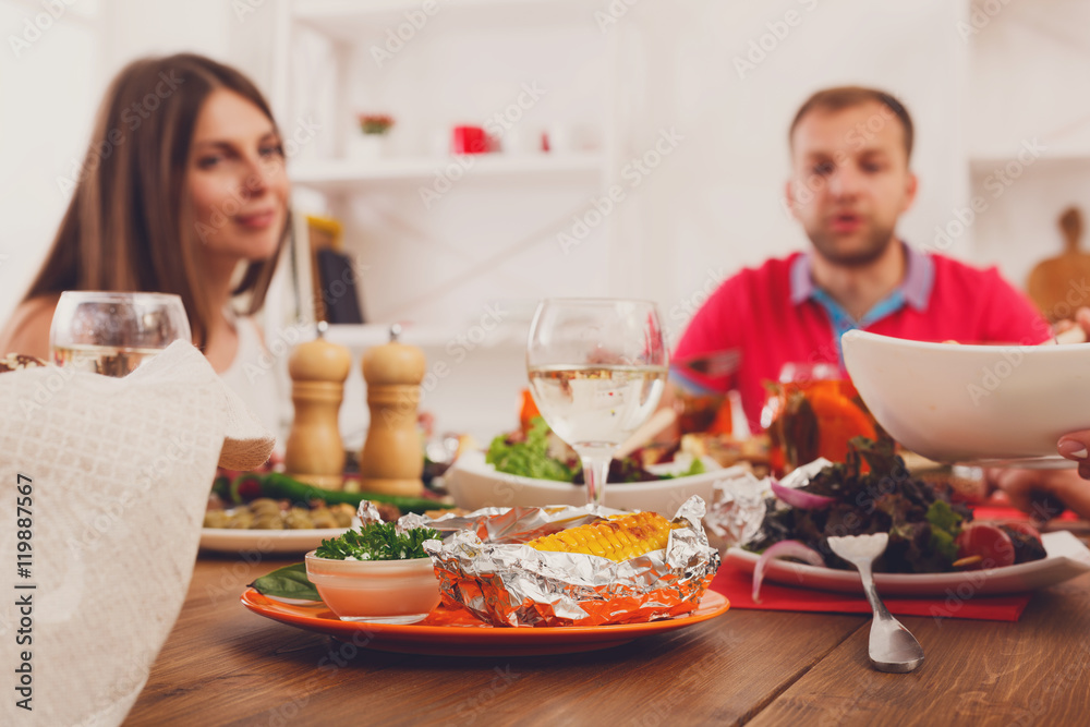 Served table at dinner party, people unfocused Served table at dinner party, people unfocused