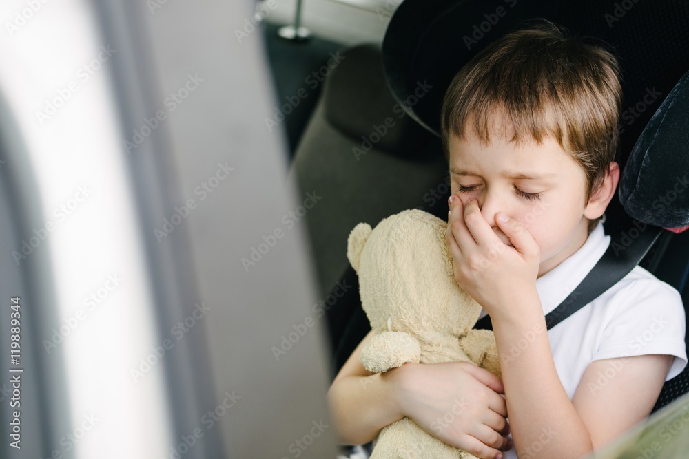 Child suffers from motion sickness in car