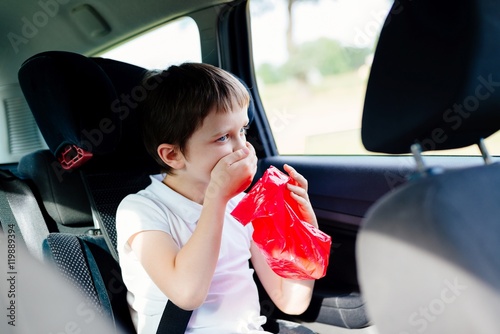 Fotografi Seven years old child vomiting in car