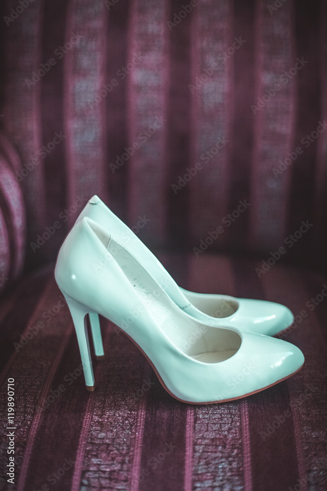Wedding shoes on an old chair, interior. Wedding shoes on an old chair, interior.