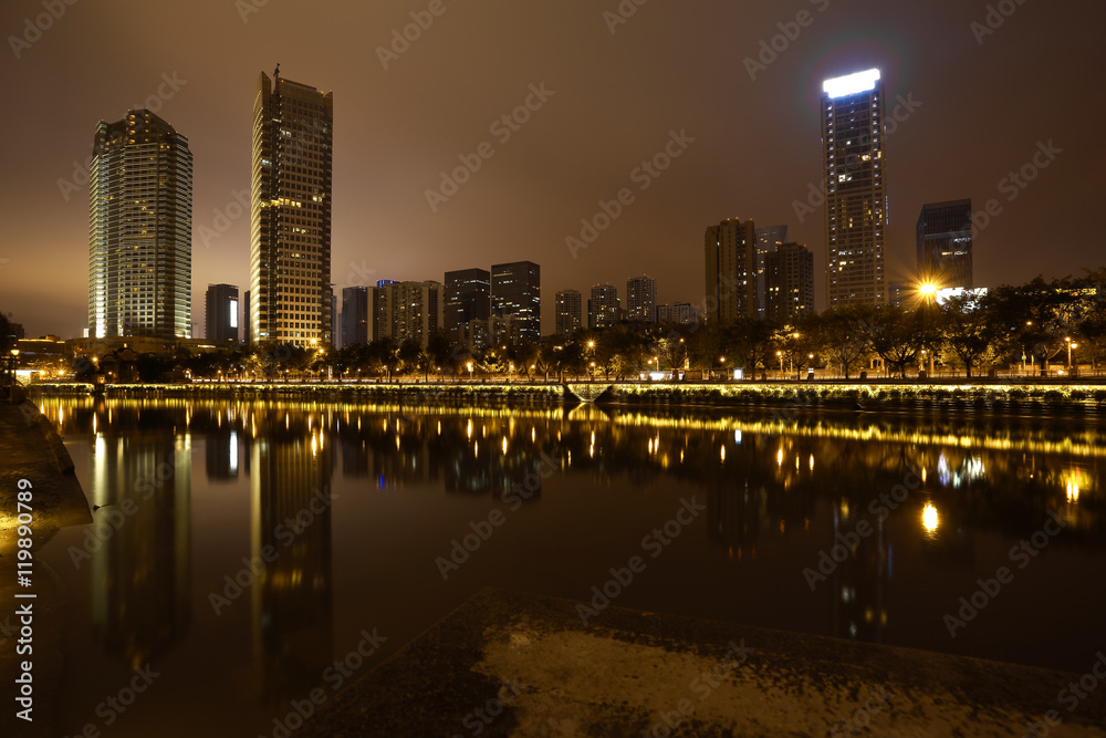 Fototapeta premium Rivers with city modern architecture background Night