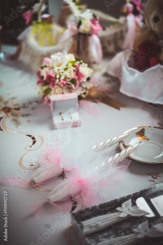 Wedding accessories. Ring box, gold rings and flowers for bridesmaids. Selective focus