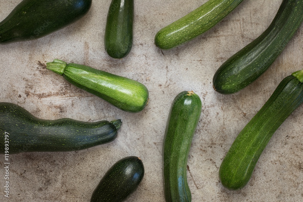 Fresh organic zucchini on the wooden table